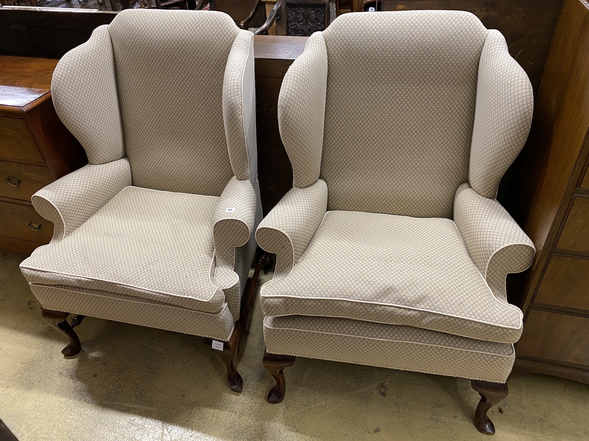 A good pair of George III style upholstered wing armchairs, width 84cm, depth 74cm, height 116cm